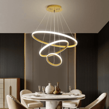 Load image into Gallery viewer, Gold LED Ring Chandelier above dining room table
