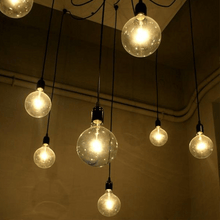 Load image into Gallery viewer, Close-up of Cavelights Spider Chandelier bulbs
