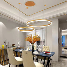 Load image into Gallery viewer, Gold Circle LED Chandelier hanging above dining table
